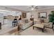 Comfortable living room with a ceiling fan, white sofas, and an open kitchen at 12760 Indian Rocks Rd # 510, Largo, FL 33774