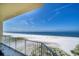 Expansive balcony view overlooking a pristine beach and clear blue ocean at 15 Somerset St # 6A, Clearwater Beach, FL 33767
