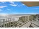 Relaxing balcony view showcasing a serene beach and ocean landscape at 15 Somerset St # 6A, Clearwater Beach, FL 33767