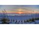 Picturesque beach scene with a colorful sunset over the ocean, framed by dune grasses at 15 Somerset St # 6A, Clearwater Beach, FL 33767