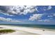 Breathtaking aerial beach view featuring fluffy clouds and clear ocean waters at 15 Somerset St # 6A, Clearwater Beach, FL 33767