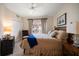 Comfortable bedroom with ceiling fan, closet, and a window with outside views at 15 Somerset St # 6A, Clearwater Beach, FL 33767