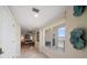 Bright hallway with marble floors leads to a living room and balcony overlooking the water at 15 Somerset St # 6A, Clearwater Beach, FL 33767