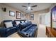Home theater with reclining seating, movie posters, large screen tv, and ceiling fan at 15 Somerset St # 6A, Clearwater Beach, FL 33767
