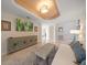 Bright living room with stylish decor, a large TV, and comfortable seating at 15 Somerset St # 6A, Clearwater Beach, FL 33767