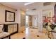 Inviting lobby with tiled floors, seating, and decorative accents, leading to entry doors and community mailboxes at 15 Somerset St # 6A, Clearwater Beach, FL 33767