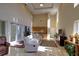 Bright lounge area with high ceilings, plush seating, a kitchenette, and access to outdoor views at 15 Somerset St # 6A, Clearwater Beach, FL 33767
