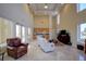 Open lounge space filled with natural light, comfortable furniture, a kitchenette, and large windows at 15 Somerset St # 6A, Clearwater Beach, FL 33767