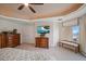 Comfortable main bedroom with mounted television, seating, and scenic balcony views at 15 Somerset St # 6A, Clearwater Beach, FL 33767