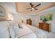 Inviting main bedroom with ensuite bathroom, closet, and dresser with mounted TV at 15 Somerset St # 6A, Clearwater Beach, FL 33767