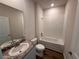 Bathroom featuring a granite countertop vanity, toilet, and tub with a shower at 18208 Beach Ranch Ter, Lakewood Ranch, FL 34211