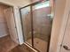 Modern shower with tiled walls and a glass door at 18208 Beach Ranch Ter, Lakewood Ranch, FL 34211