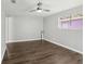 Spacious bedroom with dark laminate flooring and ceiling fan at 1601 41St S St, St Petersburg, FL 33711