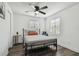 Bright bedroom with gray bedding and ceiling fan at 1816 E Juneau St, Tampa, FL 33604