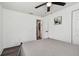 Well-lit bedroom with gray bedding and access to hallway at 1816 E Juneau St, Tampa, FL 33604