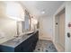 Elegant condo lobby with dark dresser, lamps, and mirror at 15 Somerset St # 6A, Clearwater Beach, FL 33767