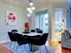 Modern dining room with hardwood floors, a table for six, and stylish light fixture at 1513 Wharfside Dr # 1513, Tarpon Springs, FL 34689