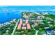 Aerial view showing waterfront property, marina, and surrounding landscape at 1513 Wharfside Dr # 1513, Tarpon Springs, FL 34689