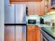 Modern kitchen with stainless steel appliances and ample wood cabinetry at 1513 Wharfside Dr # 1513, Tarpon Springs, FL 34689