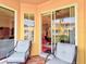 Relaxing balcony with patio furniture and sliding doors at 1513 Wharfside Dr # 1513, Tarpon Springs, FL 34689