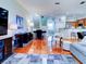 Open concept living space with hardwood floors at 1513 Wharfside Dr # 1513, Tarpon Springs, FL 34689