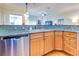 Kitchen boasts granite countertops, stainless steel appliances, and ample cabinetry at 1513 Wharfside Dr # 1513, Tarpon Springs, FL 34689