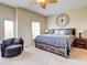 King-size bedroom with large windows and a ceiling fan at 1513 Wharfside Dr # 1513, Tarpon Springs, FL 34689
