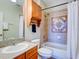 Bathroom with tub, shower, and wooden vanity at 1513 Wharfside Dr # 1513, Tarpon Springs, FL 34689