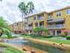 Condo community with canal, lush landscaping at 1513 Wharfside Dr # 1513, Tarpon Springs, FL 34689