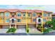Three-story townhome with attached garage and Spanish-style architecture at 1513 Wharfside Dr # 1513, Tarpon Springs, FL 34689