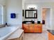 Bathroom with a large soaking tub and double vanity at 1513 Wharfside Dr # 1513, Tarpon Springs, FL 34689