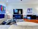 Spacious living room with a fireplace and large TV at 1513 Wharfside Dr # 1513, Tarpon Springs, FL 34689