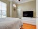 Spacious bedroom with king bed, large TV, and ample closet space at 1513 Wharfside Dr # 1513, Tarpon Springs, FL 34689