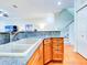 Kitchen features granite countertops, stainless steel appliances, and wood cabinets at 1513 Wharfside Dr # 1513, Tarpon Springs, FL 34689
