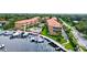 Aerial view of community, marina, and resort-style pool at 1513 Wharfside Dr # 1513, Tarpon Springs, FL 34689