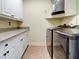 Laundry room with washer, dryer, and countertop space at 1513 Wharfside Dr # 1513, Tarpon Springs, FL 34689