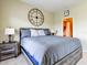 King-size bedroom with large windows and a ceiling fan at 1513 Wharfside Dr # 1513, Tarpon Springs, FL 34689