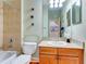 Updated bathroom with a tub, shower, and wood vanity at 1513 Wharfside Dr # 1513, Tarpon Springs, FL 34689