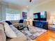 Spacious living room with hardwood floors and sectional sofa at 1513 Wharfside Dr # 1513, Tarpon Springs, FL 34689