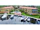 Luxury community pool and marina with boats at 1513 Wharfside Dr # 1513, Tarpon Springs, FL 34689