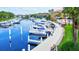 Waterfront marina with many boats and walkway at 1513 Wharfside Dr # 1513, Tarpon Springs, FL 34689