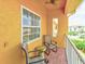Relaxing balcony with patio furniture and partial water view at 1513 Wharfside Dr # 1513, Tarpon Springs, FL 34689