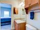 Bathroom with single sink vanity and access to bedroom at 1513 Wharfside Dr # 1513, Tarpon Springs, FL 34689