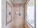 Walk-in shower with tile surround and decorative accents at 1513 Wharfside Dr # 1513, Tarpon Springs, FL 34689