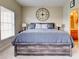 King-size bedroom with large windows and a ceiling fan at 1513 Wharfside Dr # 1513, Tarpon Springs, FL 34689