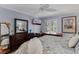 Main bedroom with a king-size bed and large dresser with mirror at 12760 Indian Rocks Rd # 510, Largo, FL 33774
