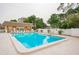 Inviting community pool with surrounding lounge chairs and landscaping at 12760 Indian Rocks Rd # 510, Largo, FL 33774