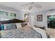 Main bedroom with king-size bed, dresser, and walk-in closet at 12760 Indian Rocks Rd # 510, Largo, FL 33774