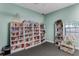 Community library with bookshelves and a comfortable seating area at 12760 Indian Rocks Rd # 510, Largo, FL 33774