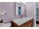 Clean bathroom with vanity, marble countertop and large mirror at 12760 Indian Rocks Rd # 510, Largo, FL 33774